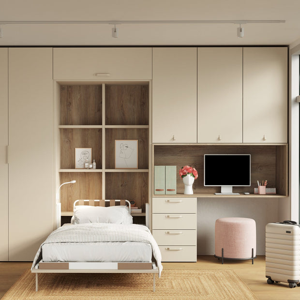 Space saving bedroom with singe wall bed and integrated desk and storage